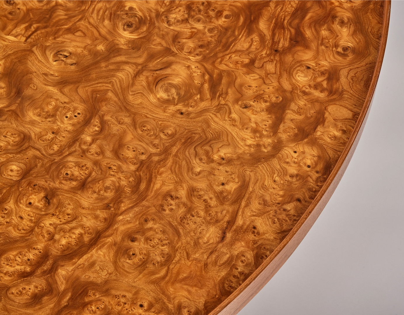 JOSEF FRANK. Coffee table, Svenskt Tenn, model number 2139, round top veneered with elm root, profiled edge, marked Svenskt Tenn.