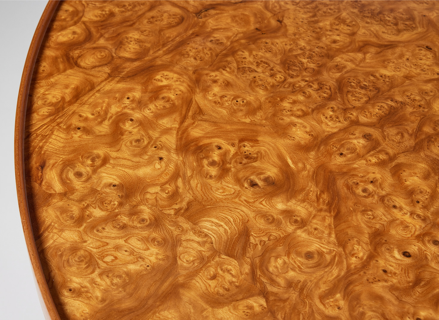 JOSEF FRANK. Coffee table, Svenskt Tenn, model number 2139, round top veneered with elm root, profiled edge, marked Svenskt Tenn.