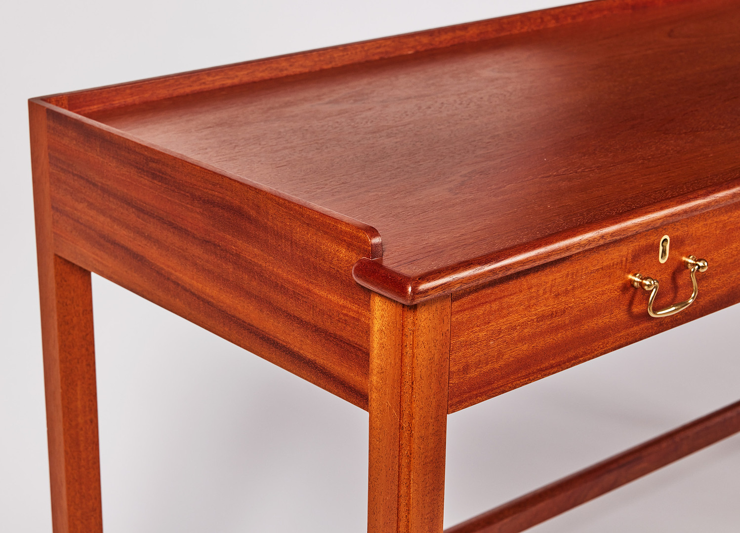 JOSEF FRANK. Sideboard, model no. 2115, Svenskt Tenn, veneered in mahogany, fittings in brass, the board with edging.
