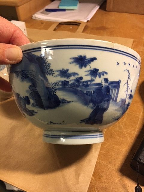 A BLUE AND WHITE BOWL.