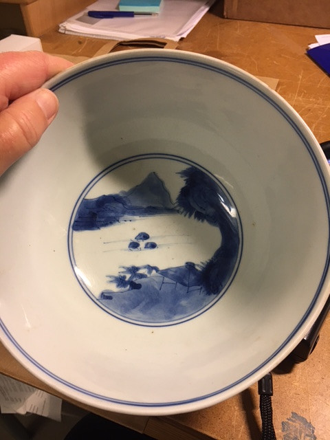 A BLUE AND WHITE BOWL.
