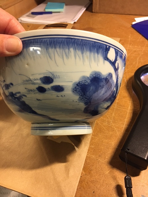 A BLUE AND WHITE BOWL.