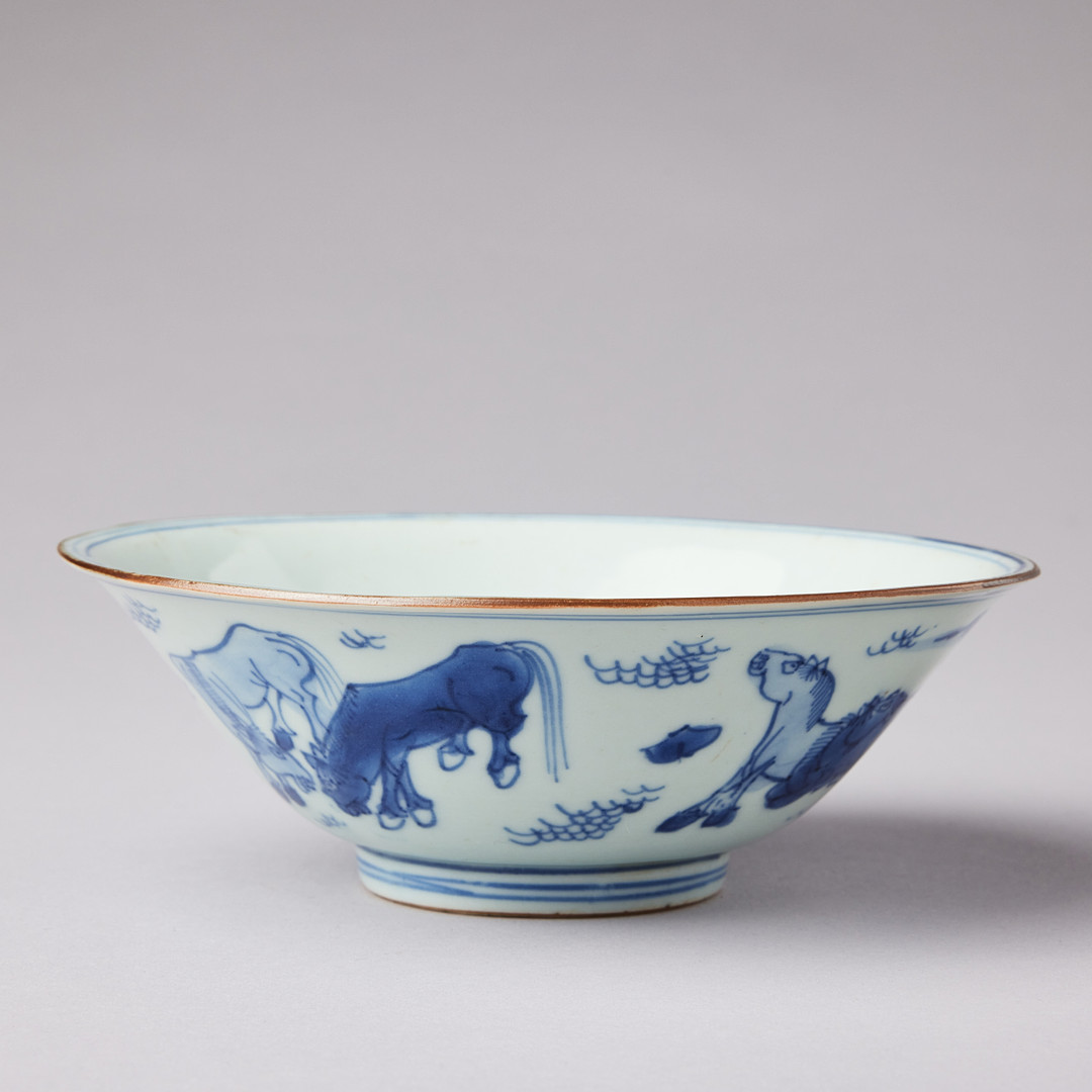 A BLUE AND WHITE 'HORSES' BOWL.