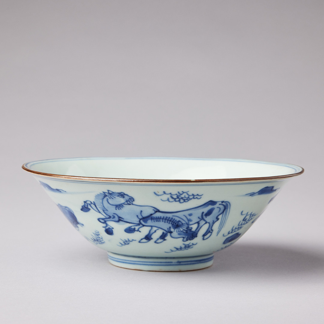 A BLUE AND WHITE 'HORSES' BOWL.
