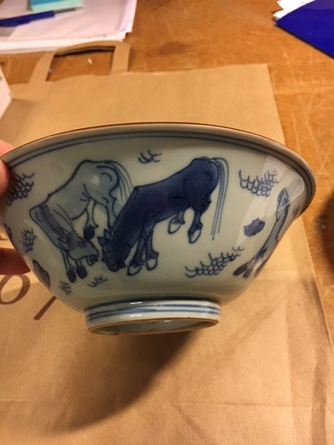 A BLUE AND WHITE 'HORSES' BOWL.