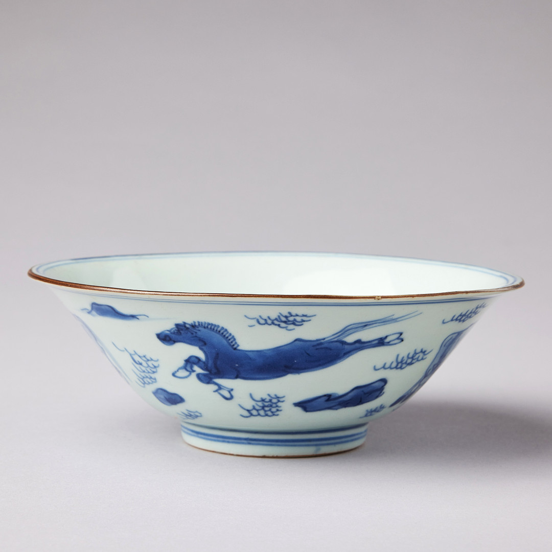 A BLUE AND WHITE 'HORSES' BOWL.