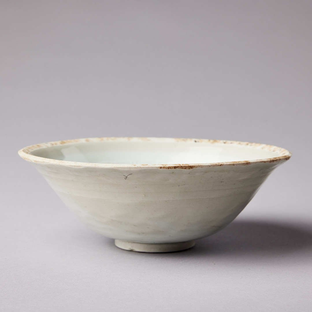 A MOULDED QINGBAI 'LOTUS' BOWL.