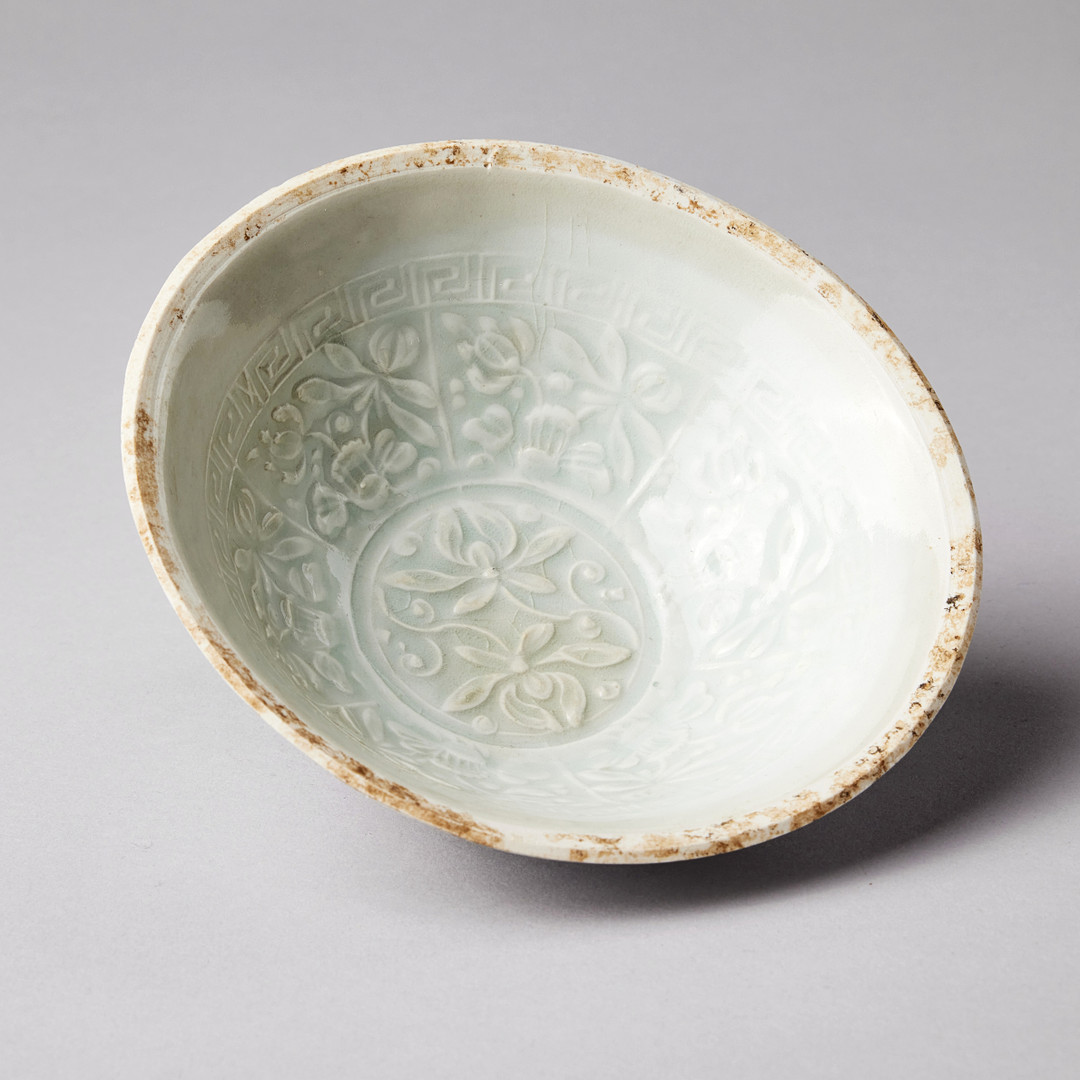 A MOULDED QINGBAI 'LOTUS' BOWL.