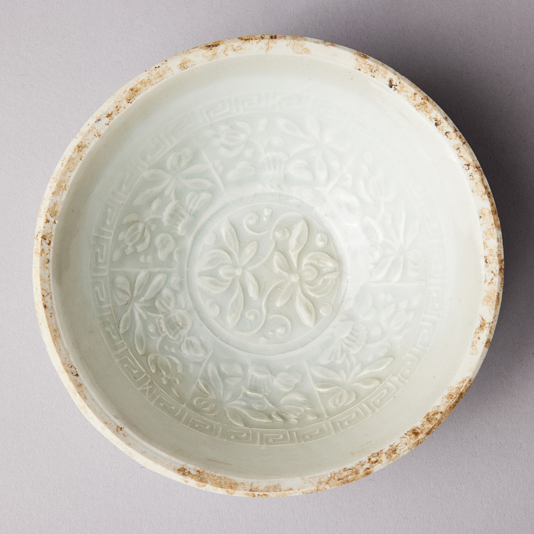 A MOULDED QINGBAI 'LOTUS' BOWL.
