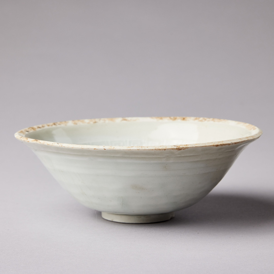 A MOULDED QINGBAI 'LOTUS' BOWL.