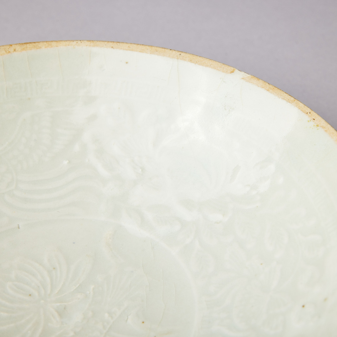 A MOULDED QINGBAI 'PHOENIX' BOWL.