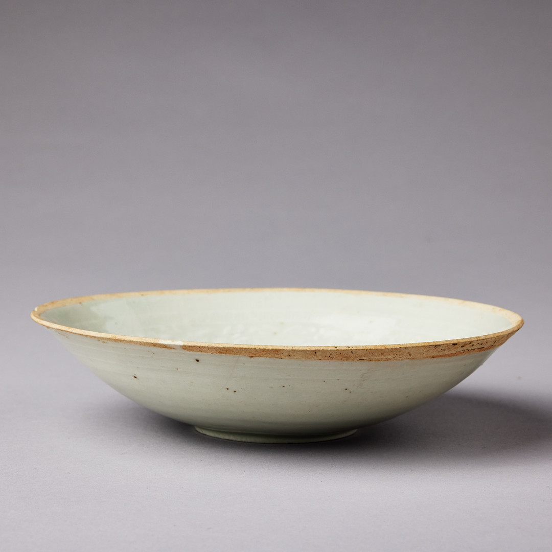 A MOULDED QINGBAI 'PHOENIX' BOWL.