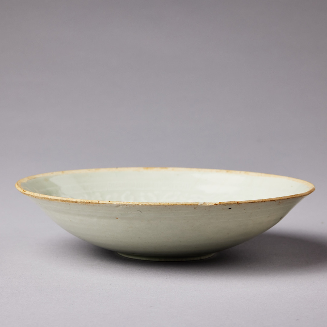 A MOULDED QINGBAI 'PHOENIX' BOWL.