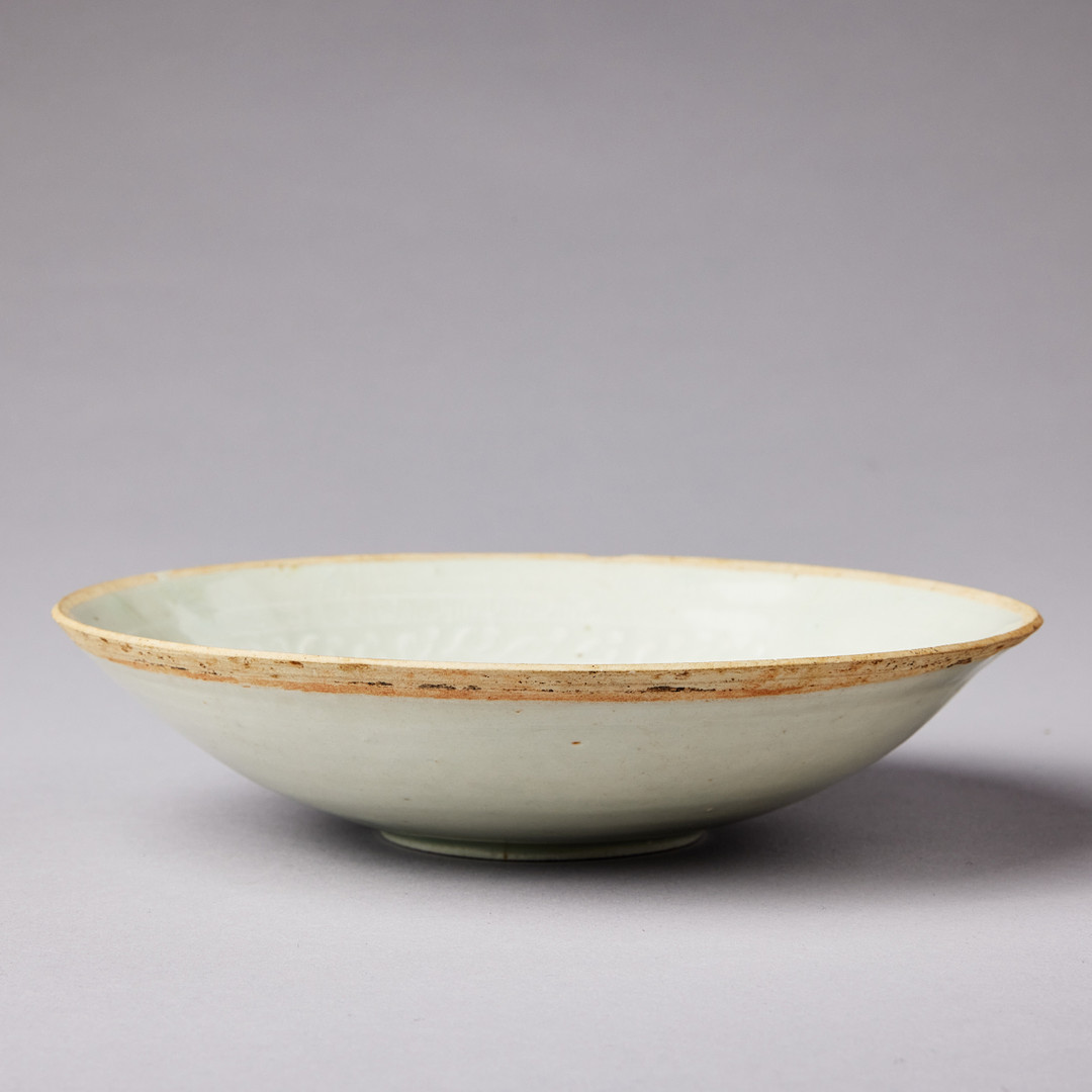 A MOULDED QINGBAI 'PHOENIX' BOWL.