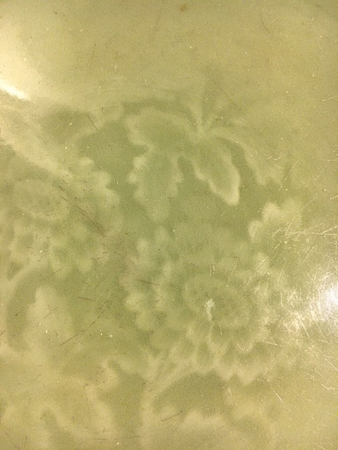 A CELADON CARVED AND IMPRESSED DISH.