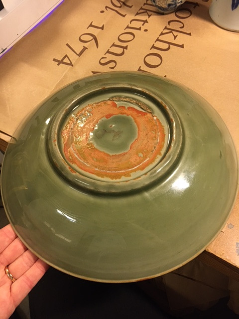 A CELADON CARVED AND IMPRESSED DISH.