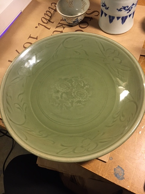 A CELADON CARVED AND IMPRESSED DISH.
