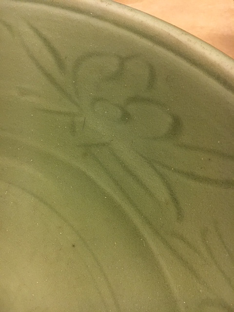 A CELADON CARVED AND IMPRESSED DISH.