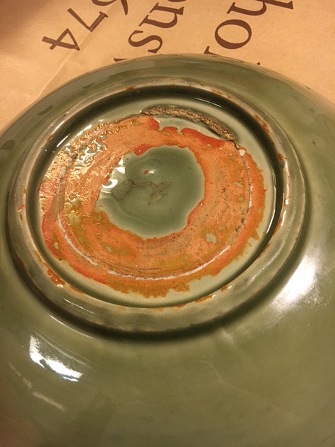 A CELADON CARVED AND IMPRESSED DISH.