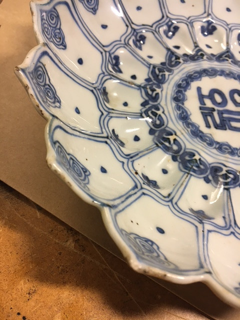 A RARE BLUE AND WHITE MOLDED 'LOTUS' DISH.