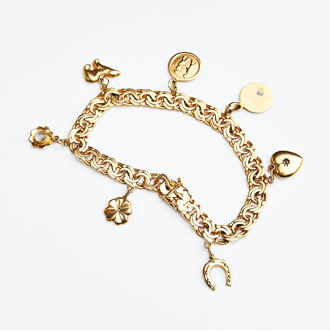 ARMBAND, 18 k guld, bismarcklänk med berlocker i form av isbjörn samt hästsko, Guldvaruaktiebolaget G. Dahlgren & Co Ab, Malmö, 1951.