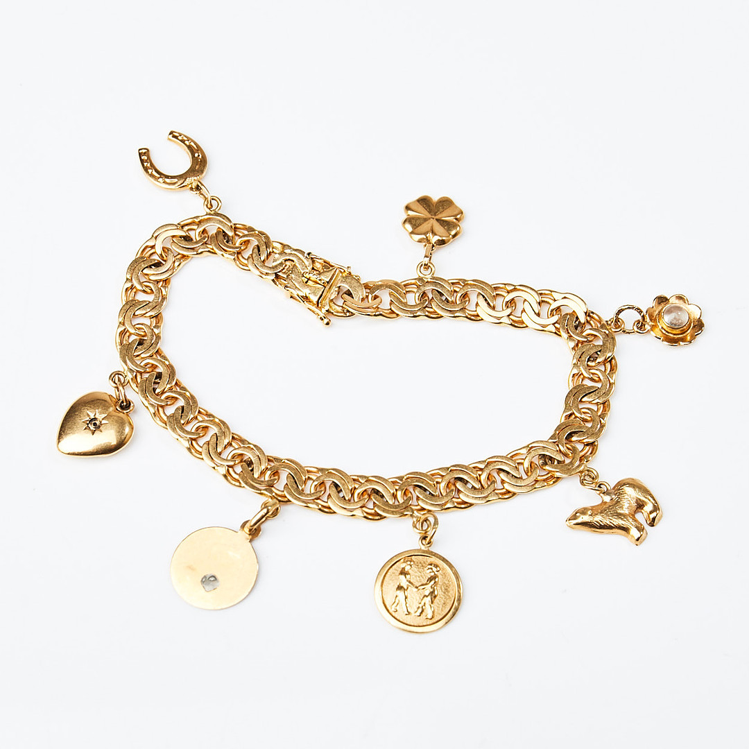ARMBAND, 18 k guld, bismarcklänk med berlocker i form av isbjörn samt hästsko, Guldvaruaktiebolaget G. Dahlgren & Co Ab, Malmö, 1951.