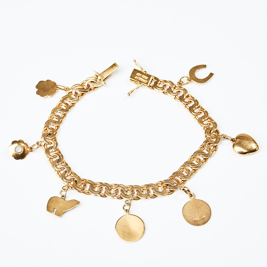 ARMBAND, 18 k guld, bismarcklänk med berlocker i form av isbjörn samt hästsko, Guldvaruaktiebolaget G. Dahlgren & Co Ab, Malmö, 1951.