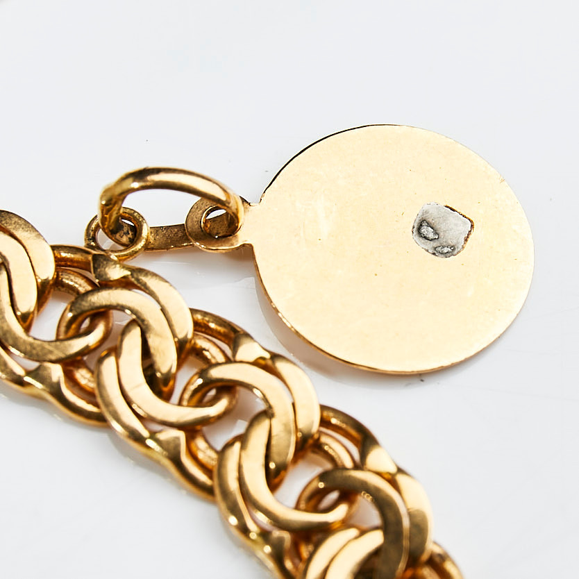 ARMBAND, 18 k guld, bismarcklänk med berlocker i form av isbjörn samt hästsko, Guldvaruaktiebolaget G. Dahlgren & Co Ab, Malmö, 1951.