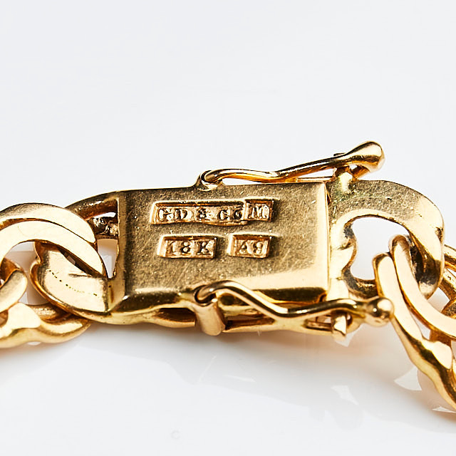 ARMBAND, 18 k guld, bismarcklänk med berlocker i form av isbjörn samt hästsko, Guldvaruaktiebolaget G. Dahlgren & Co Ab, Malmö, 1951.