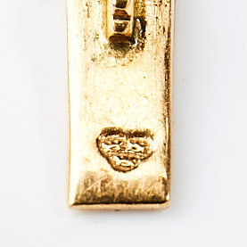 ARMBAND, 18 k guld, bismarcklänk med berlocker i form av isbjörn samt hästsko, Guldvaruaktiebolaget G. Dahlgren & Co Ab, Malmö, 1951.