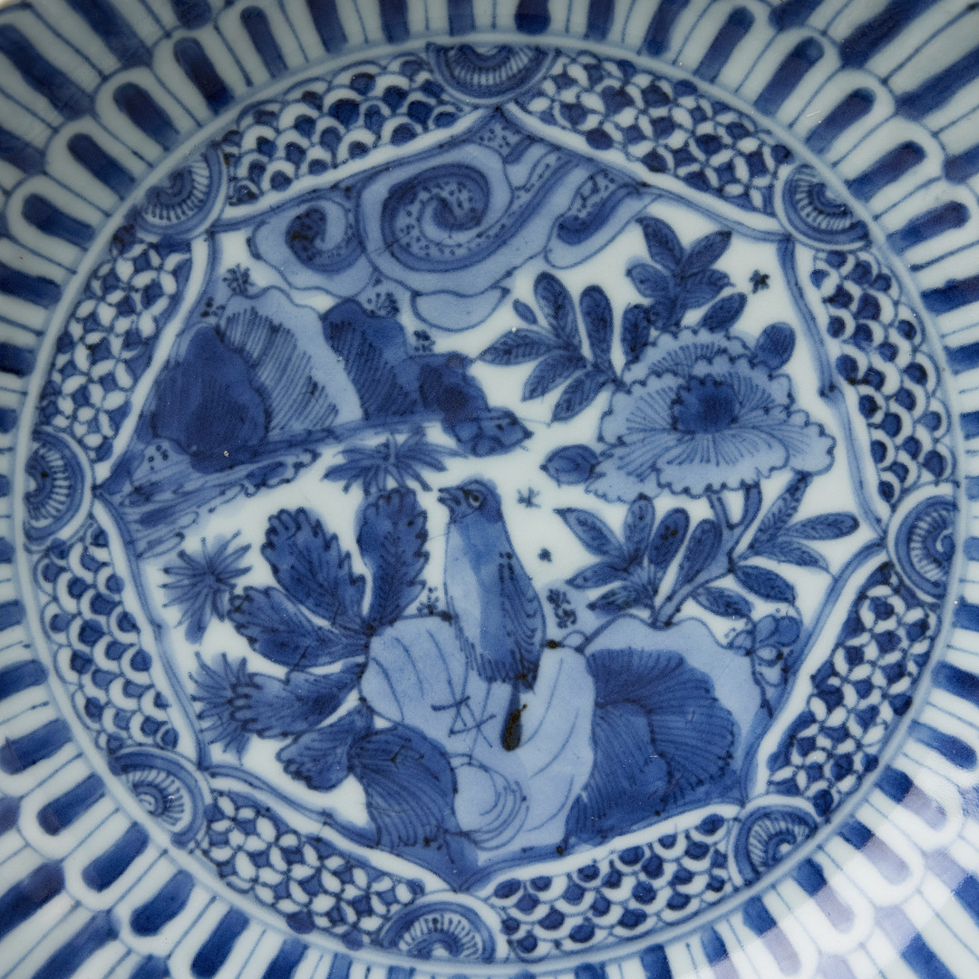 FIVE MOULDED BLUE AND WHITE SAUCER DISHES.