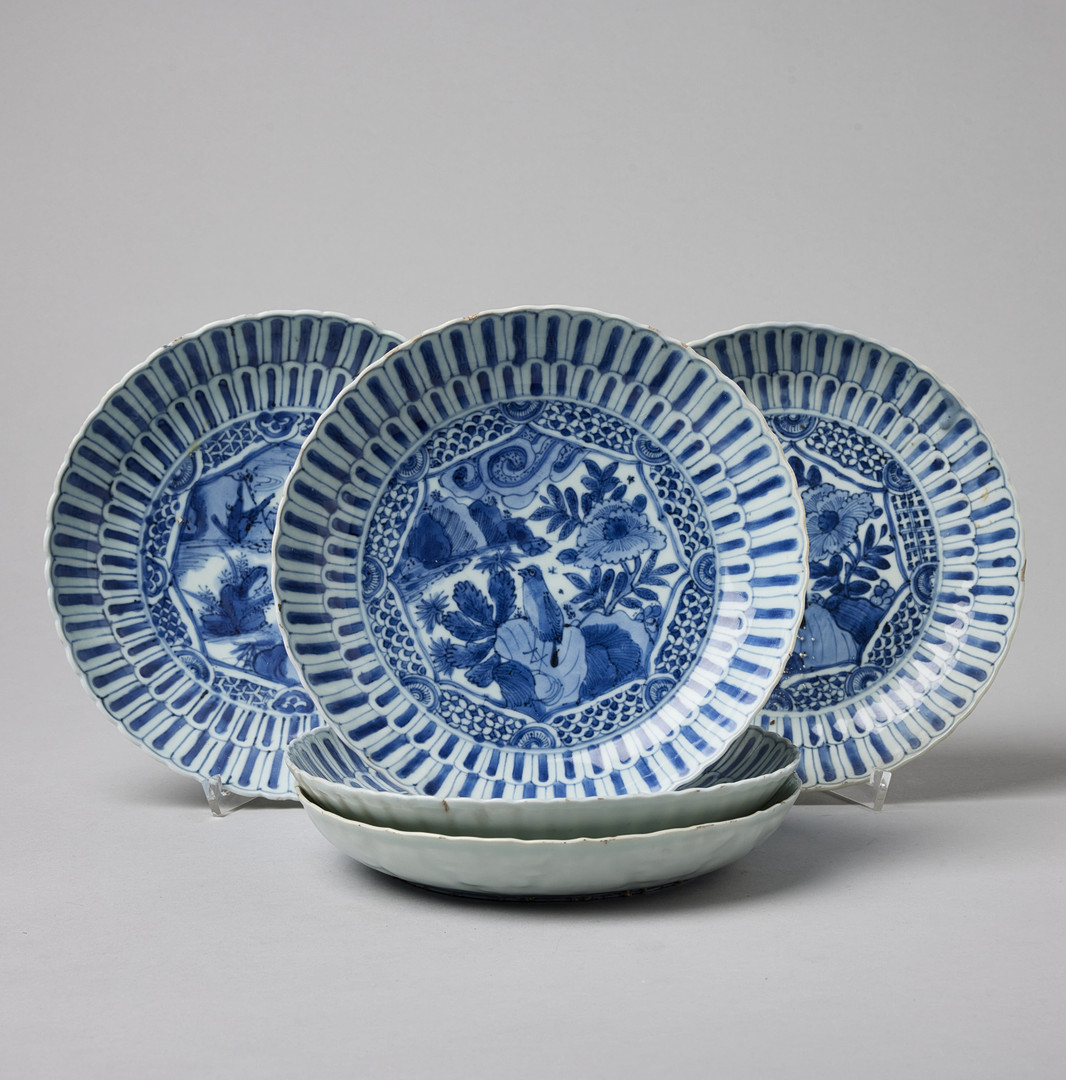 FIVE MOULDED BLUE AND WHITE SAUCER DISHES.