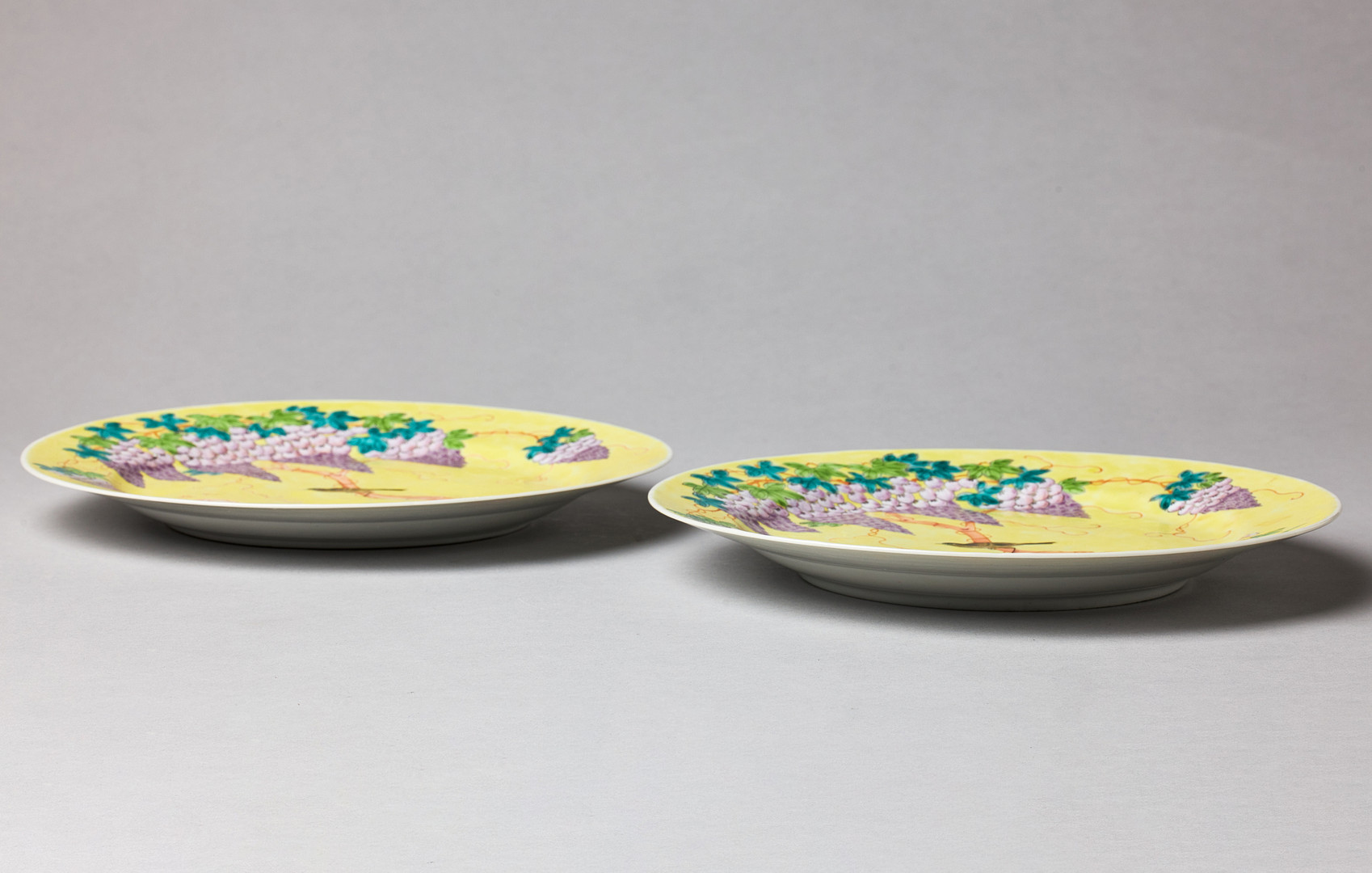 A PAIR OF DAYAZHAI FAMILLE ROSE YELLOW GROUND DISHES.