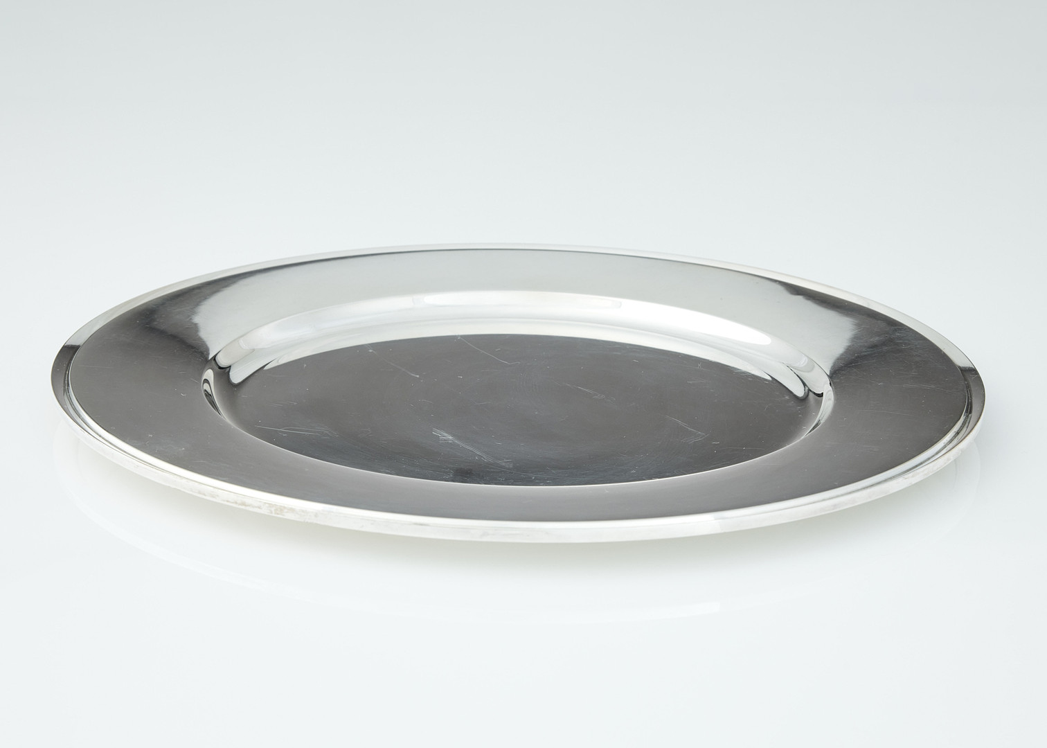 HARALD NIELSEN. Undertallrikar tolv stycken, sterlingsilver, Georg Jensen, Danmark efter 1945. Design nr 600 Y. 