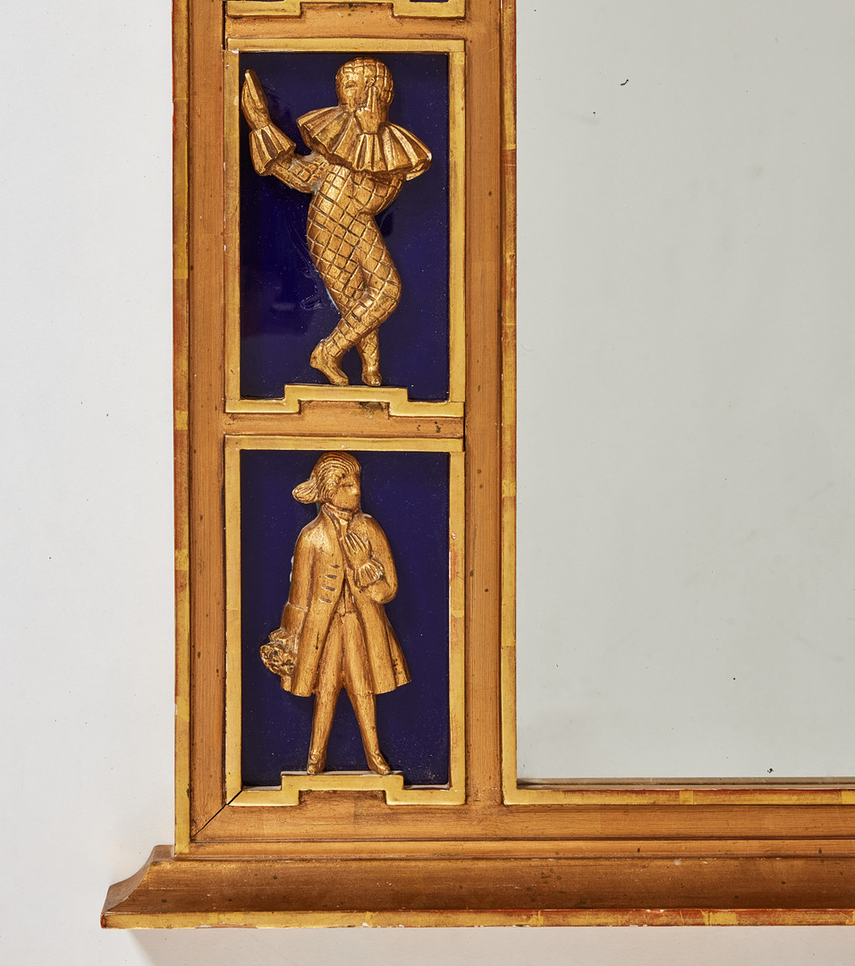 SPEGEL, Sverige 1920/30-tal, Swedish Grace, ram av förgyllt trä, med snidade figurscener mot fond av blått glas.