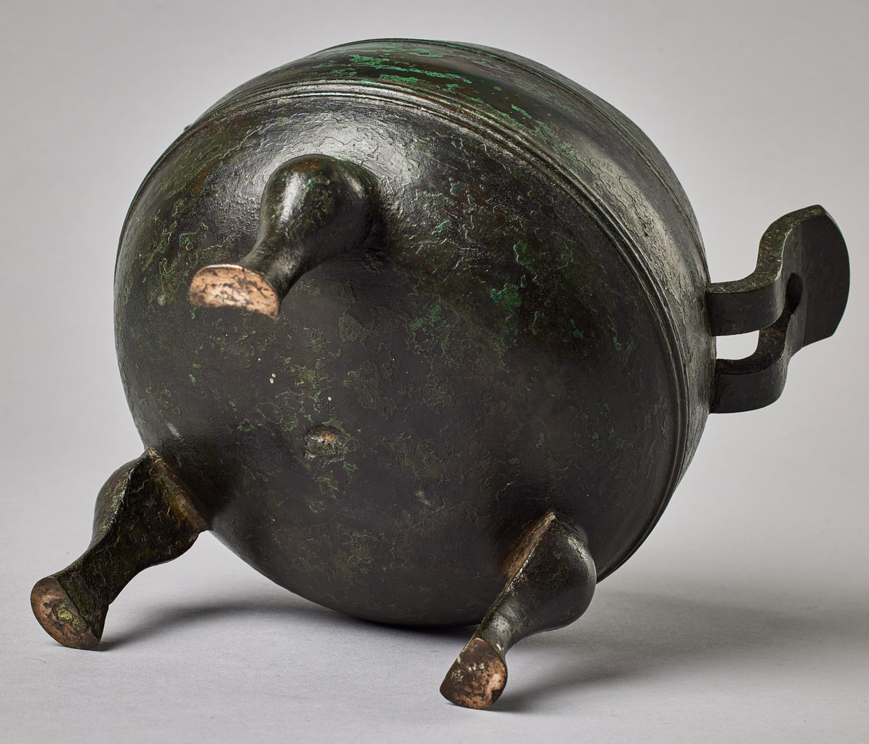A BRONZE TRIPOD 'DING'​.