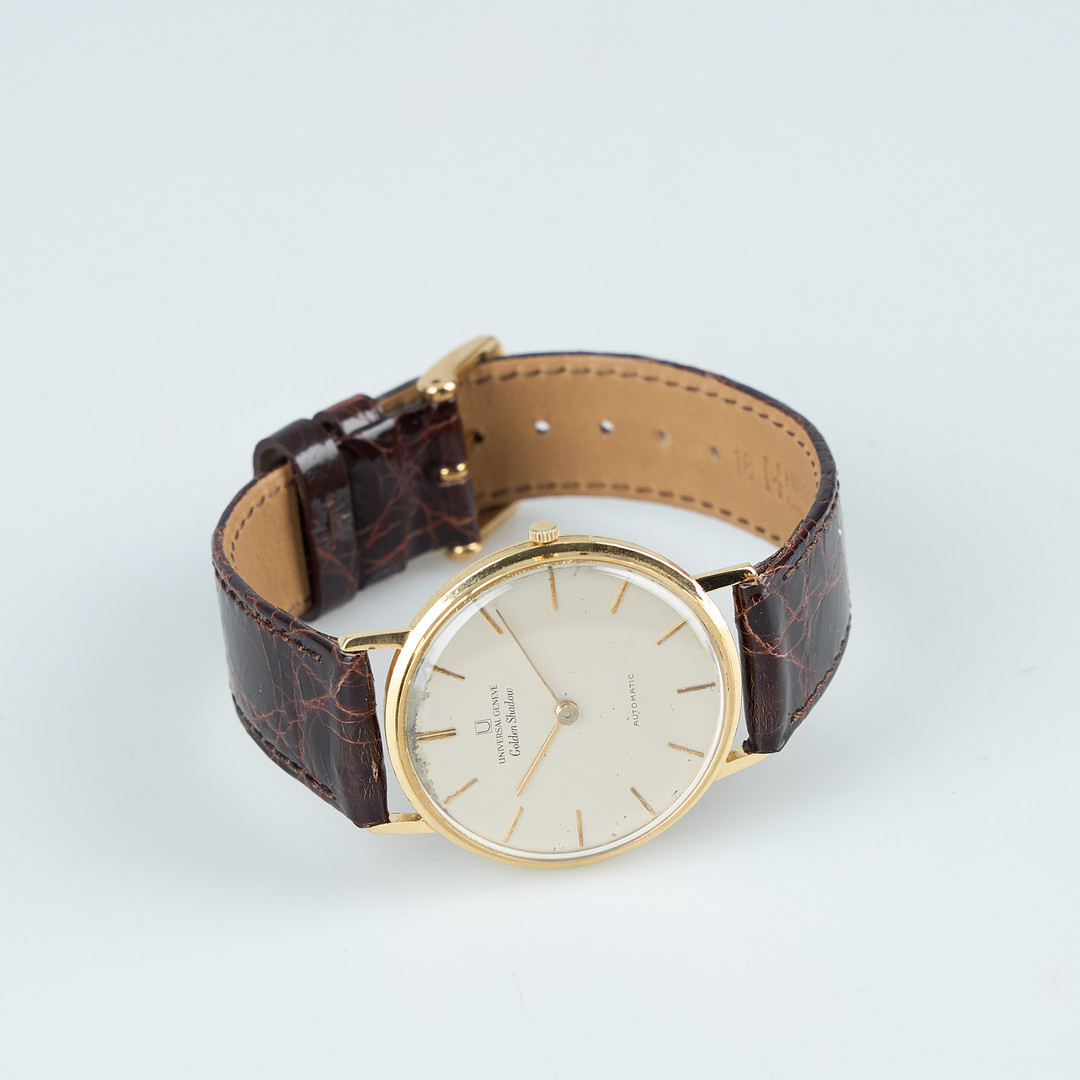UNIVERSAL GENEVE, Golden Shadow, 34 mm, 18K guld, automatisk, plexiglas, 1960-tal.