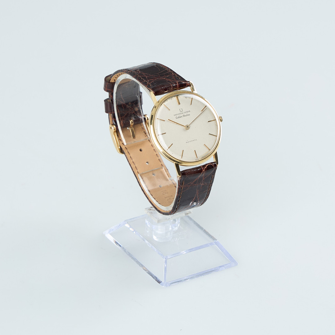UNIVERSAL GENEVE, Golden Shadow, 34 mm, 18K guld, automatisk, plexiglas, 1960-tal.
