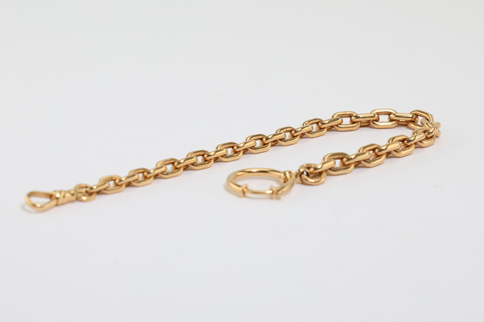 KLOCKKEDJA, 18K guld, Stockholm, 1910-/20-tal.