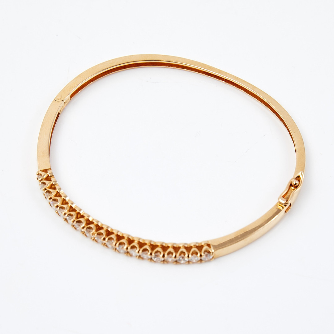 ARMBAND, stel modell, 14 k guld, med 18 st diamanter, totalt ca 1,4 ct, stämplad.