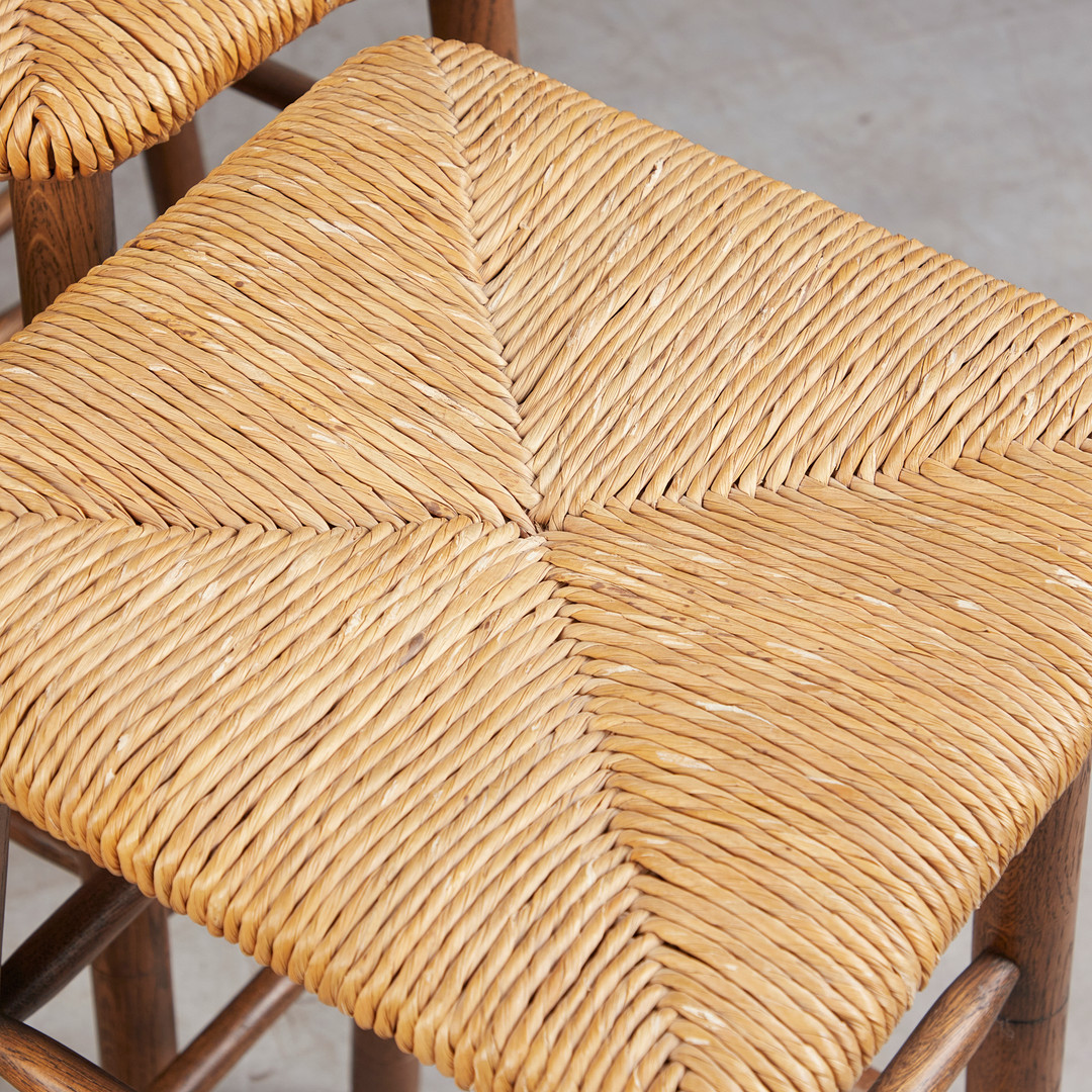 CHARLOTTE PERRIAND. im stil von, Sechs Barhocker / Stools, Eiche, Binsengeflecht, 1960er Jahre, Dänemark (6).