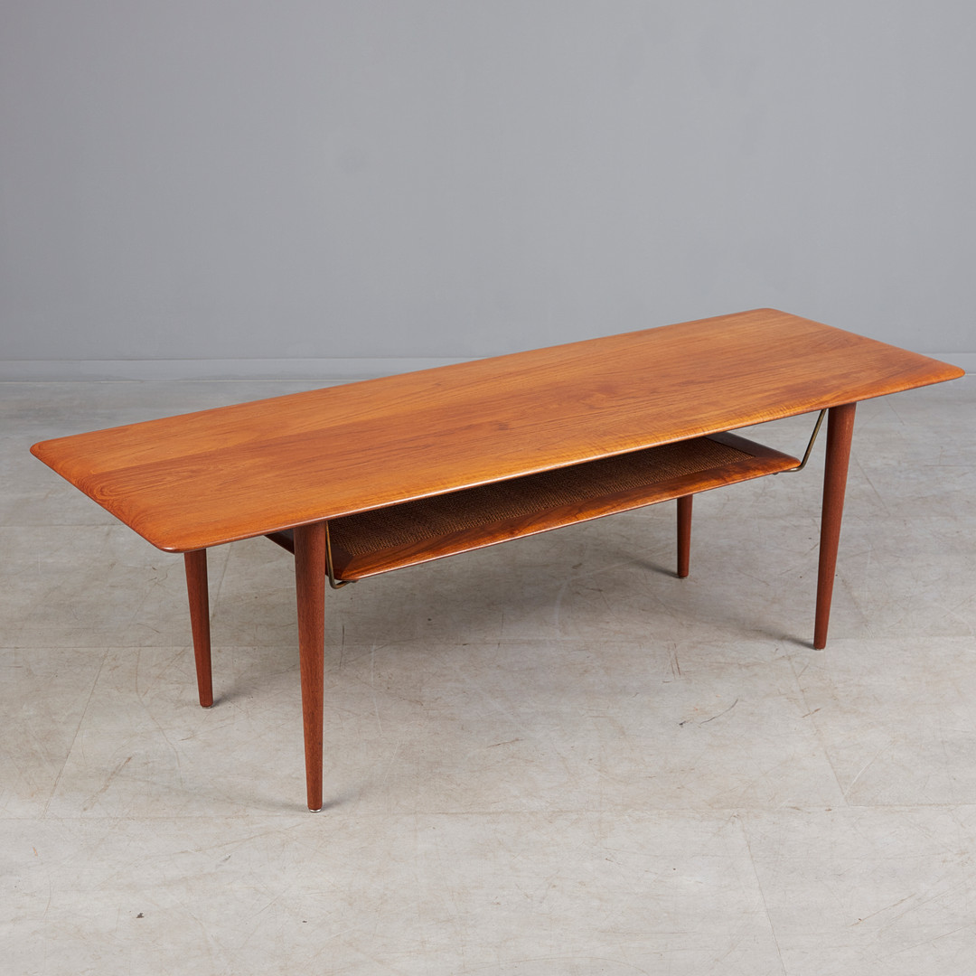 PETER HVIDT UND ORLA MOLGAARD-NIELSEN. France & Son, Couchtisch, Modell 'FD 516', Teak, Rattan, Messing, Dänemark, 1956.
