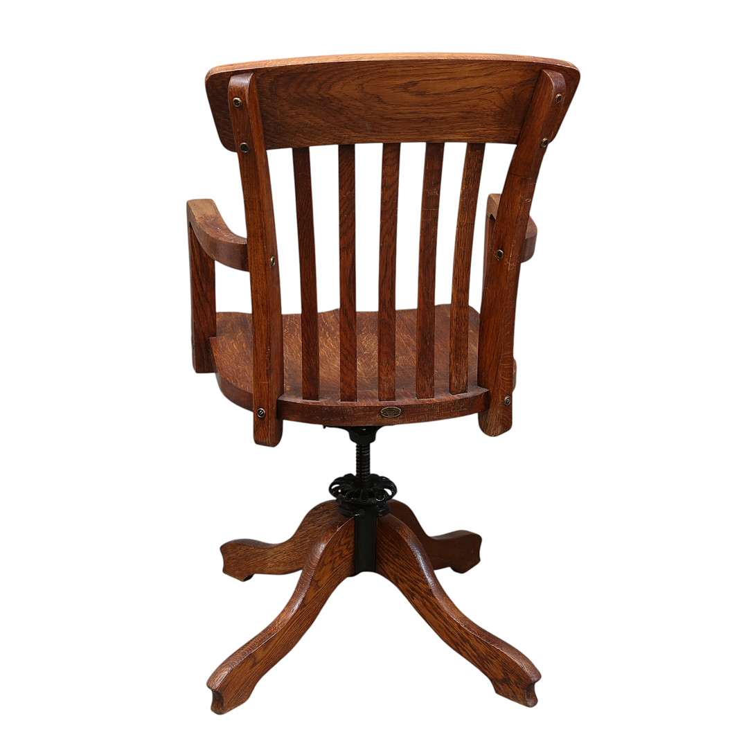 Swivel desk's chair in oak, early 20th Century.