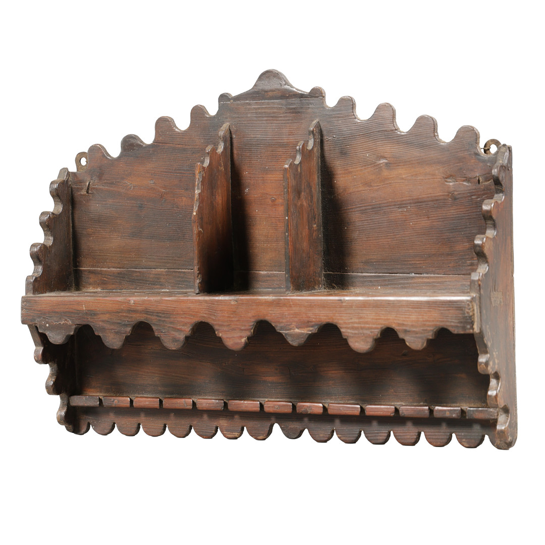 A 19TH CENTURY STAINED PINE HANGING SPOON RACK.