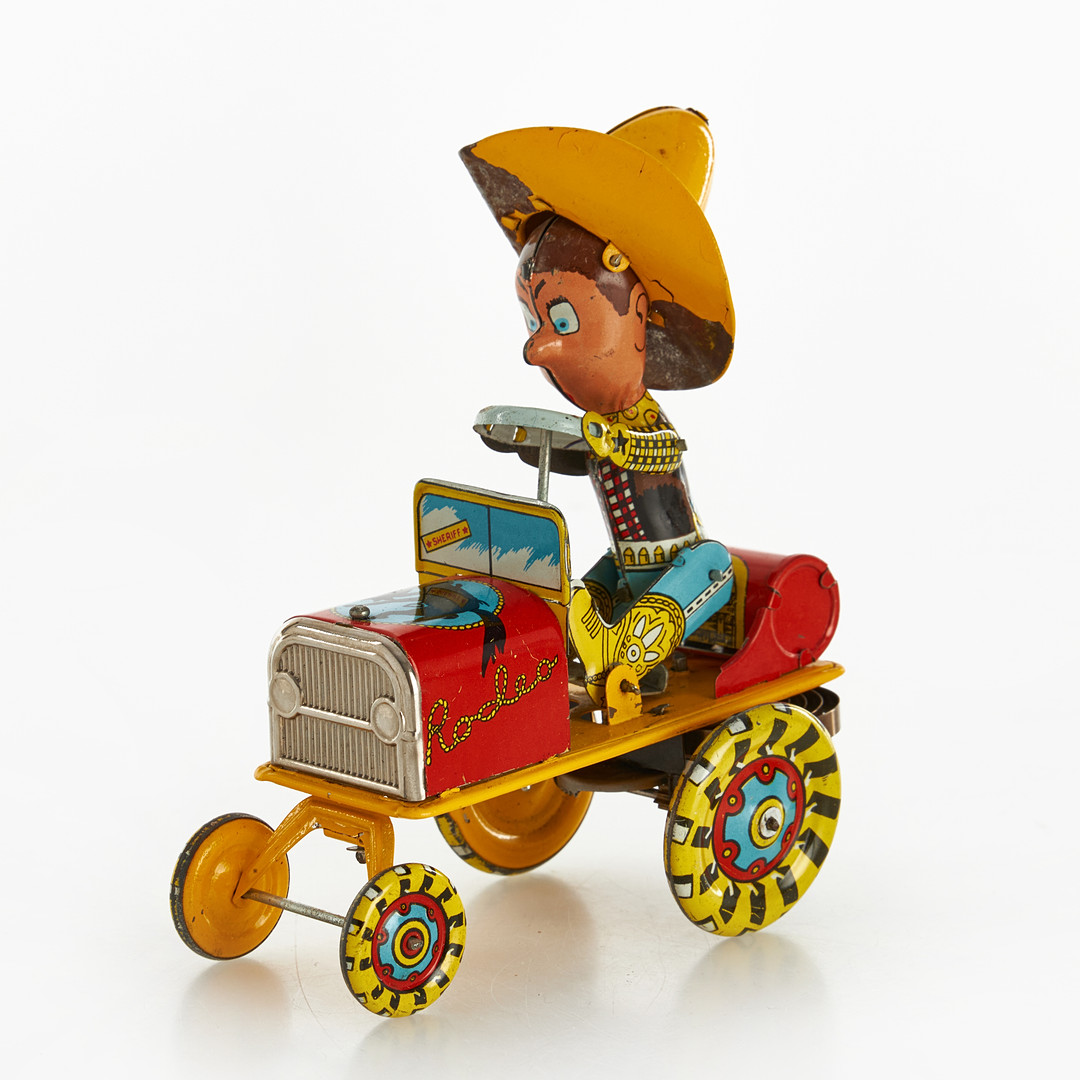 Images for 4949836. A pair of lithographed sheet metal toys, mid 20th ...