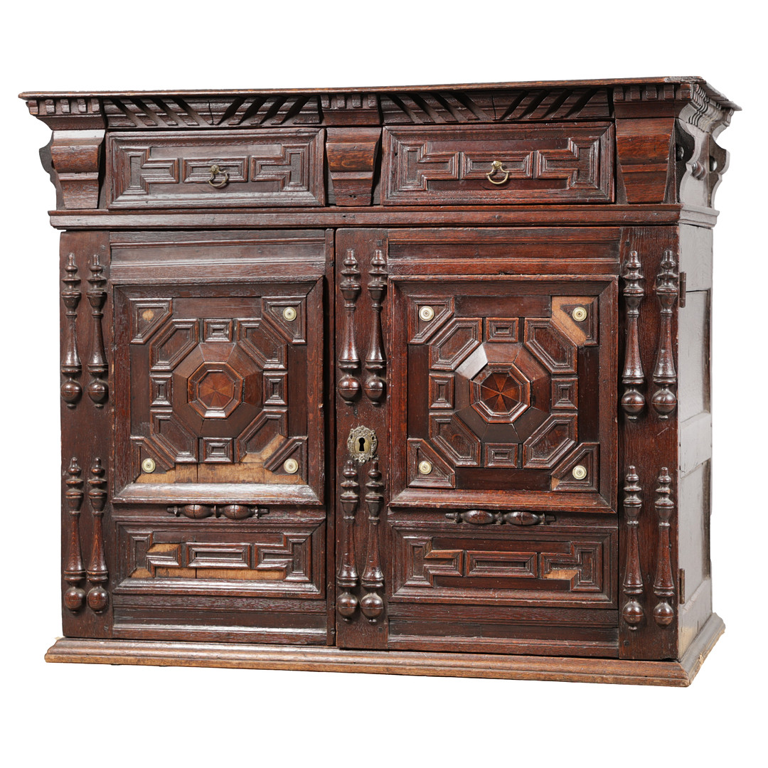 A CHARLES II OAK GEOMETRIC ENCLOSED CUPBOARD, CIRCA 1670.