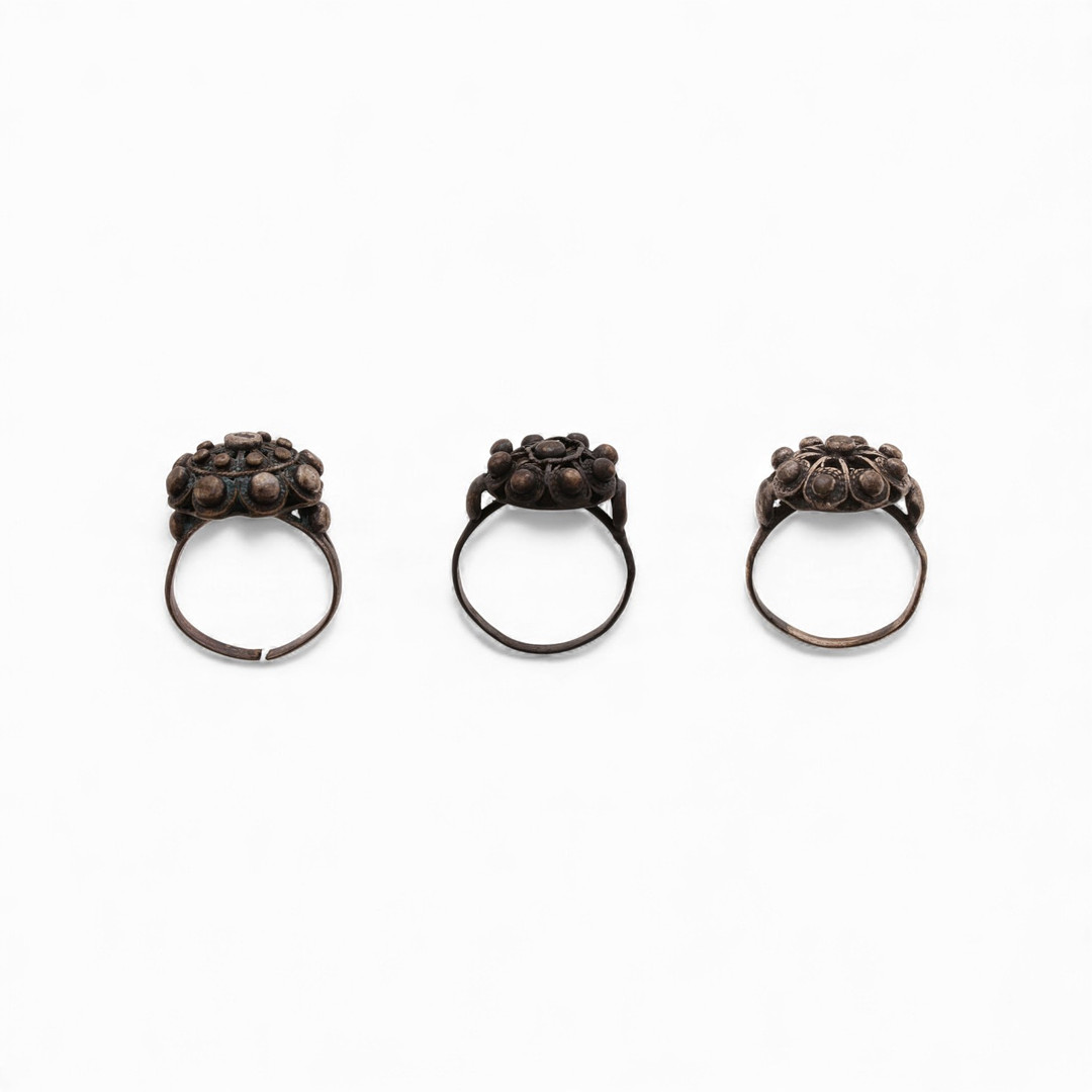 Three "charro" salamantine button rings in silver.