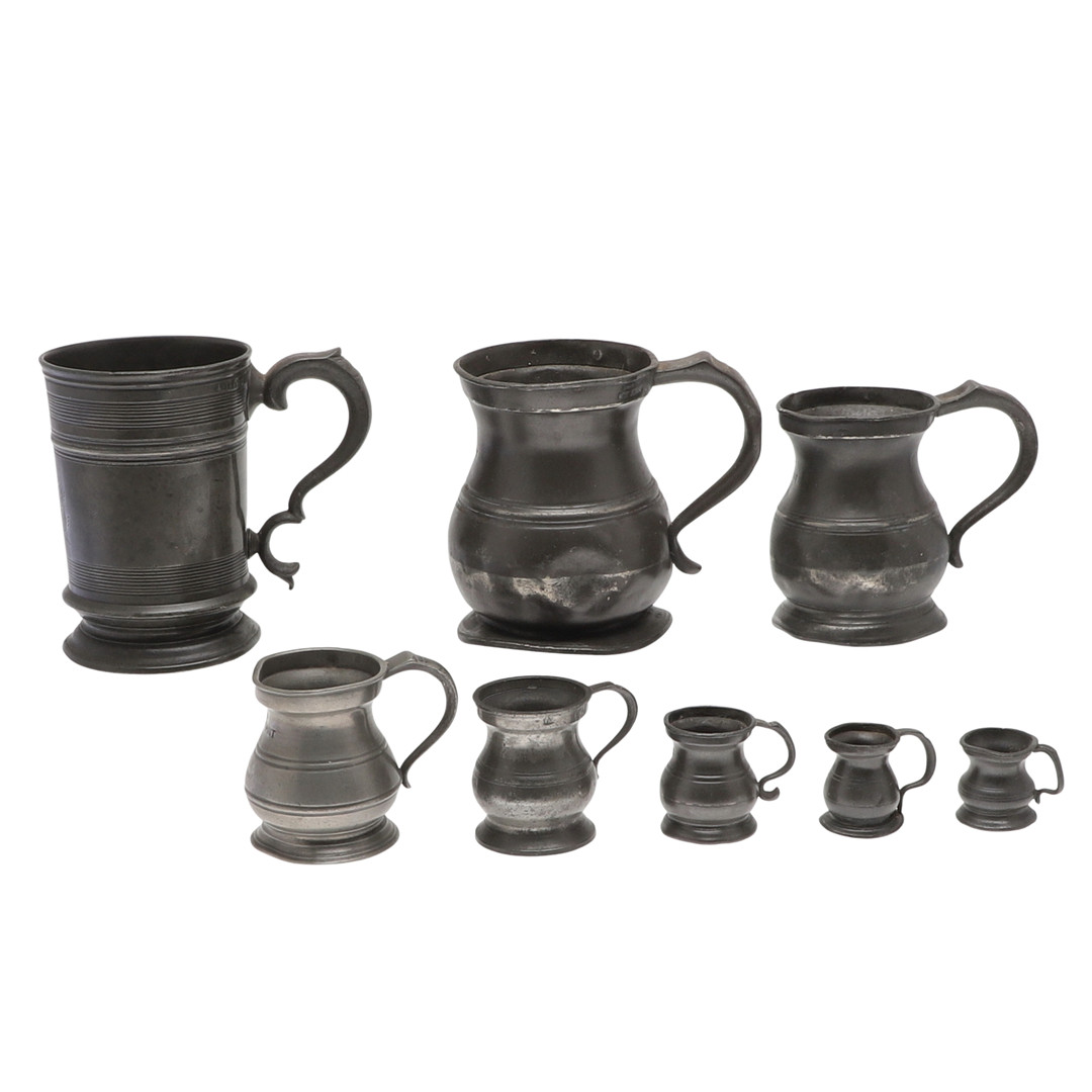 A COLLECTION OF PEWTER TANKARDS.