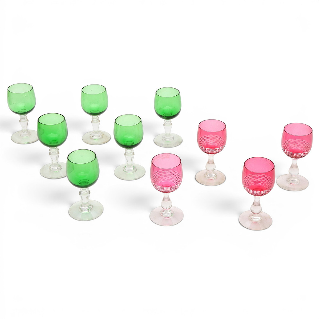 Set of six green liquour glasses and set of four rose glasses in French carved glass, early 20th Century.