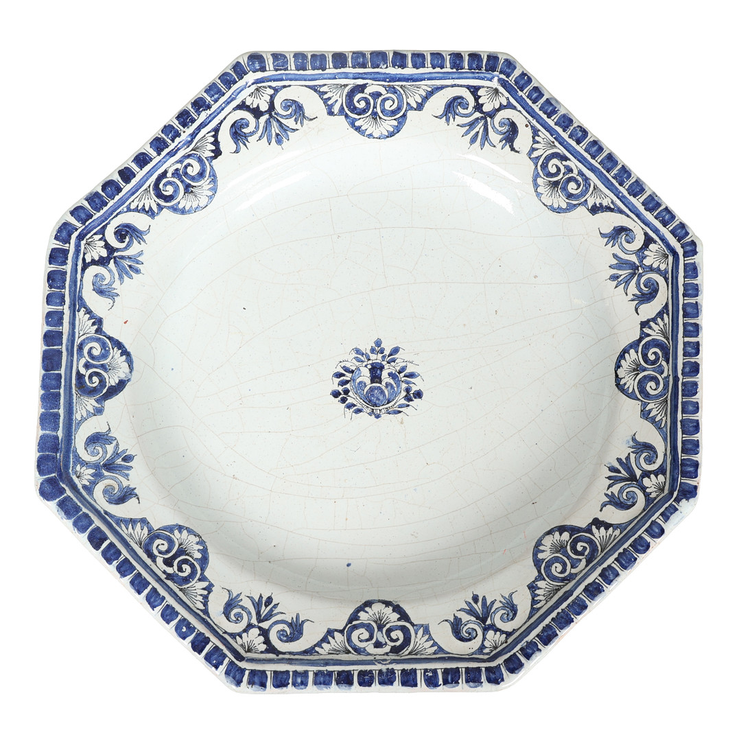 AN 18TH CENTURY MOUSTIER OCTAGONAL DISH.